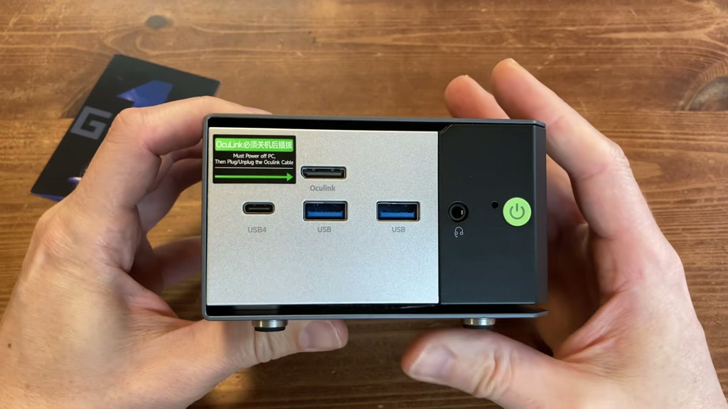 Front ports on the GMKtec K16 including OCuLink, USB4, USB-A, audio, BIOS reset, and power button