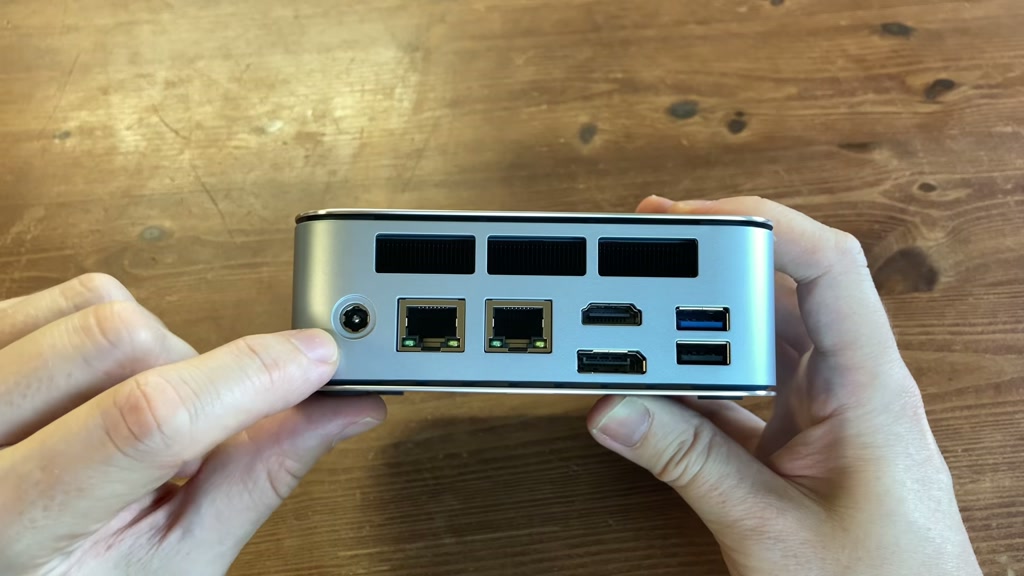 Rear ports on the Getorli GT103 showing dual Ethernet, HDMI, DisplayPort and USB